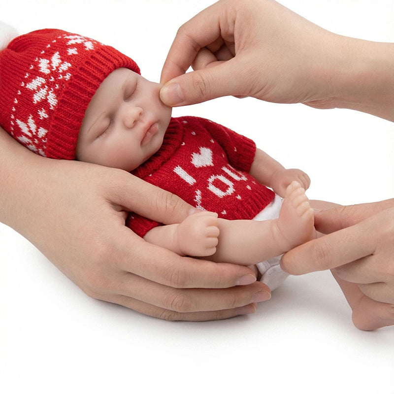 Bambola Reborn da 30 cm occhi chiusi in silicone ragazza Pickle maglione rosso