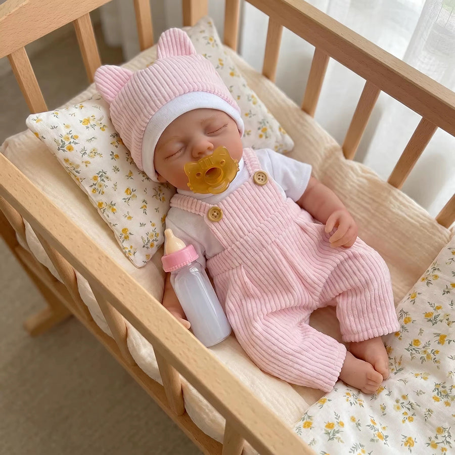 Bambola reborn Irys 30 cm realistica interamente in silicone con abito rosa