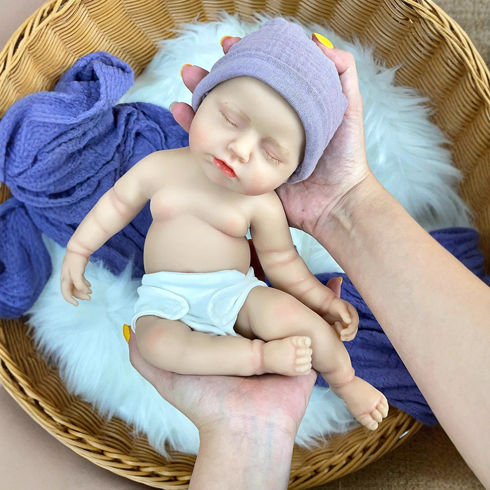 Bambola reborn realistica da 30 cm completamente in silicone addormentata con abiti viola