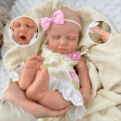 Bambola reborn Loulou alta 45cm interamente in silicone estensibile con vestito floreale