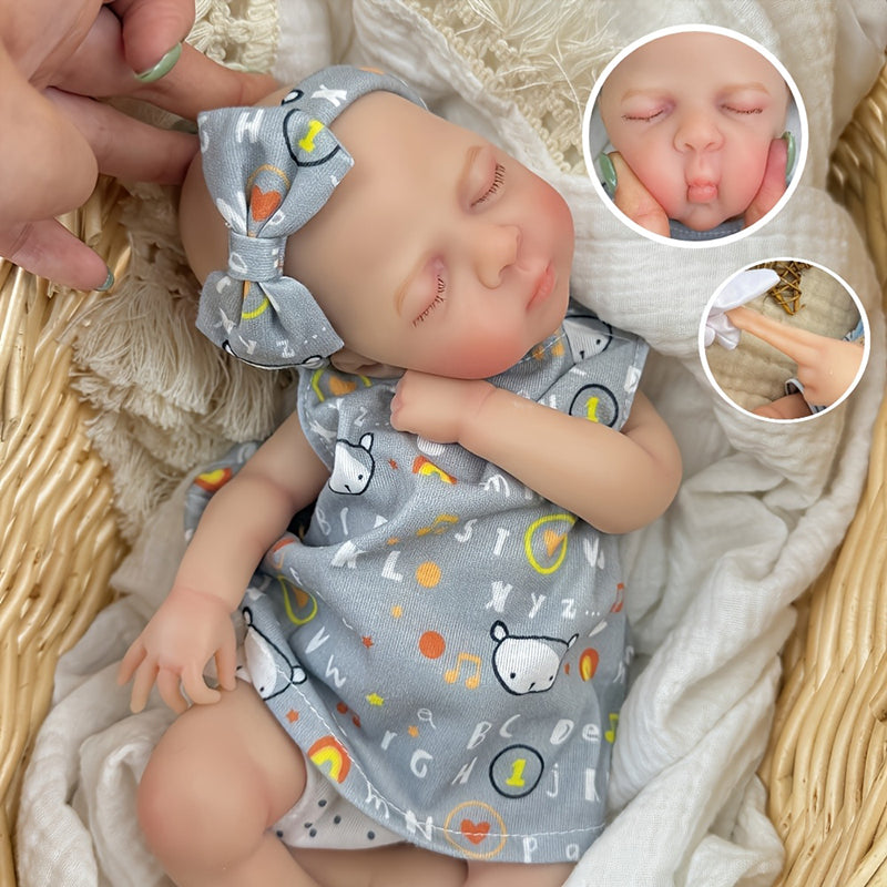 Bambina reborn in silicone realistica di 30 cm Luna con vestito grigio