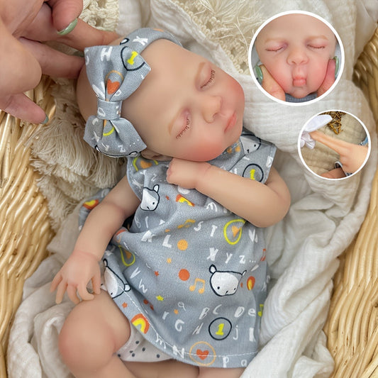 Bambina reborn in silicone realistica di 30 cm Luna con vestito grigio