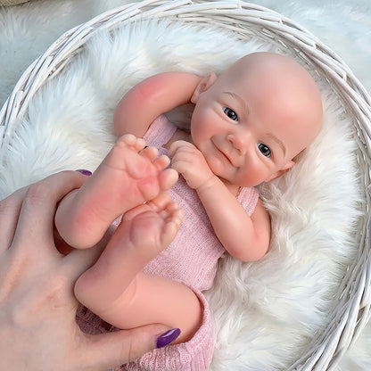 Bambola Reborn femminile Vivienne (45 cm / 18 pollici) in silicone pieno dall'aspetto realistico e con sorriso con salopette rosa