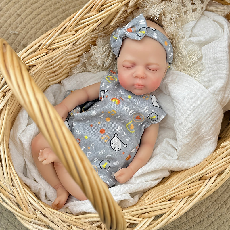 Bambina reborn in silicone realistica di 30 cm Luna con vestito grigio