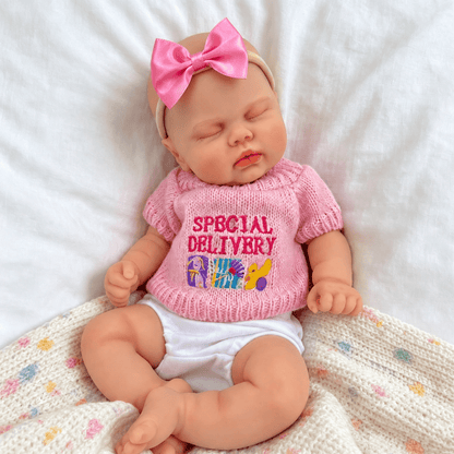 Bambola reborn realistica in silicone da 30 cm modello Pickle con maglione rosa