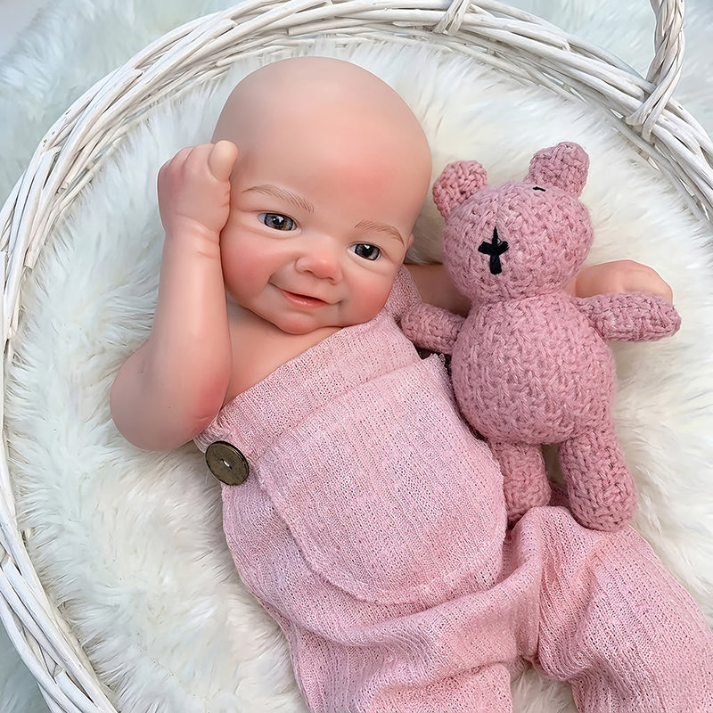 Bambola Reborn femminile Vivienne (45 cm / 18 pollici) in silicone pieno dall'aspetto realistico e con sorriso con salopette rosa