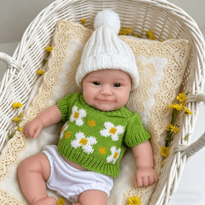Bambola reborn Maddie Smile da 30 cm interamente in silicone con vestitino verde