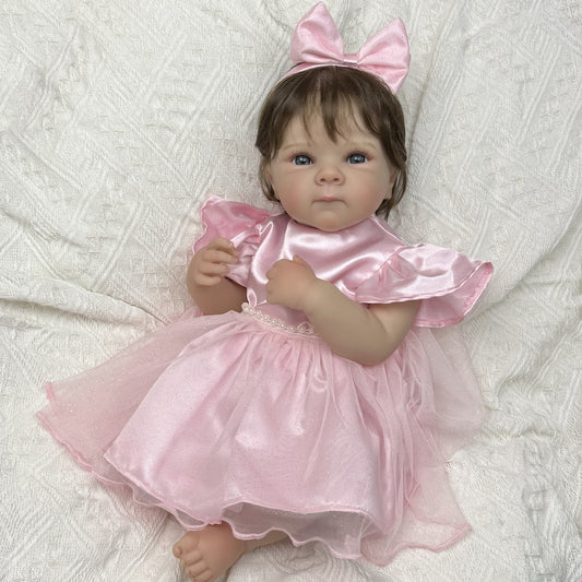 Bambina reborn Bettie 45 cm realistica in vinile con capelli corti e vestito rosa