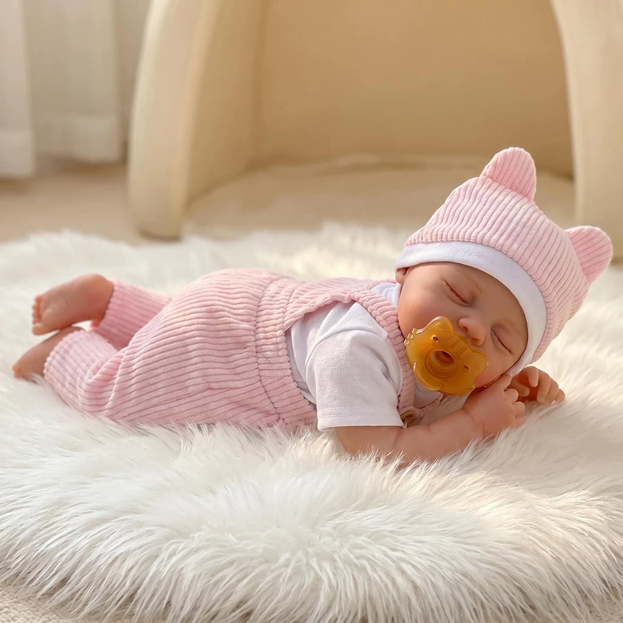 Bambola reborn Irys 30 cm realistica interamente in silicone con abito rosa