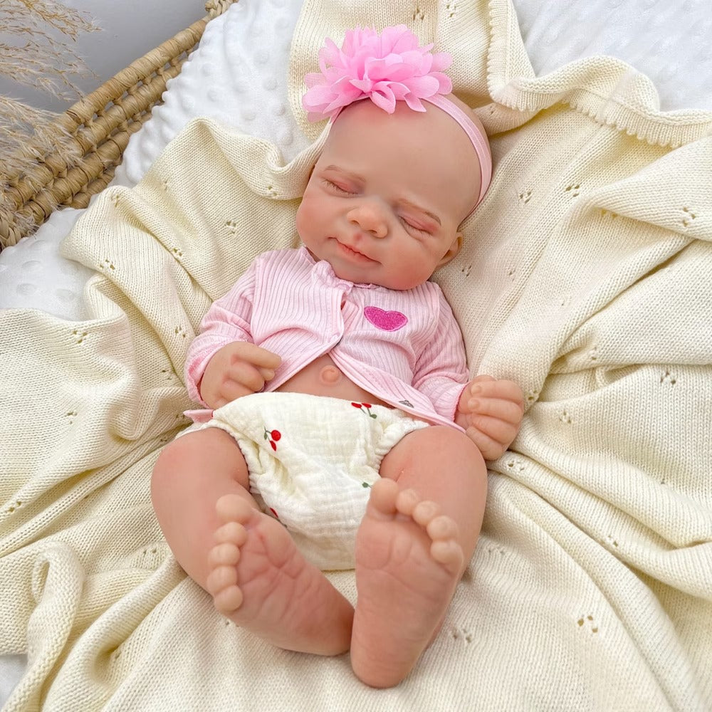 Bambola reborn Pascale in silicone alta 45 cm completamente estensibile addormentata con vestitino rosa