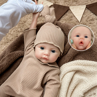 Bambina reborn Meadow in silicone integrale da 30 cm con tutina marrone
