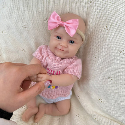 Bambola reborn Maddie Smile da 30cm interamente in silicone con vestitino rosa