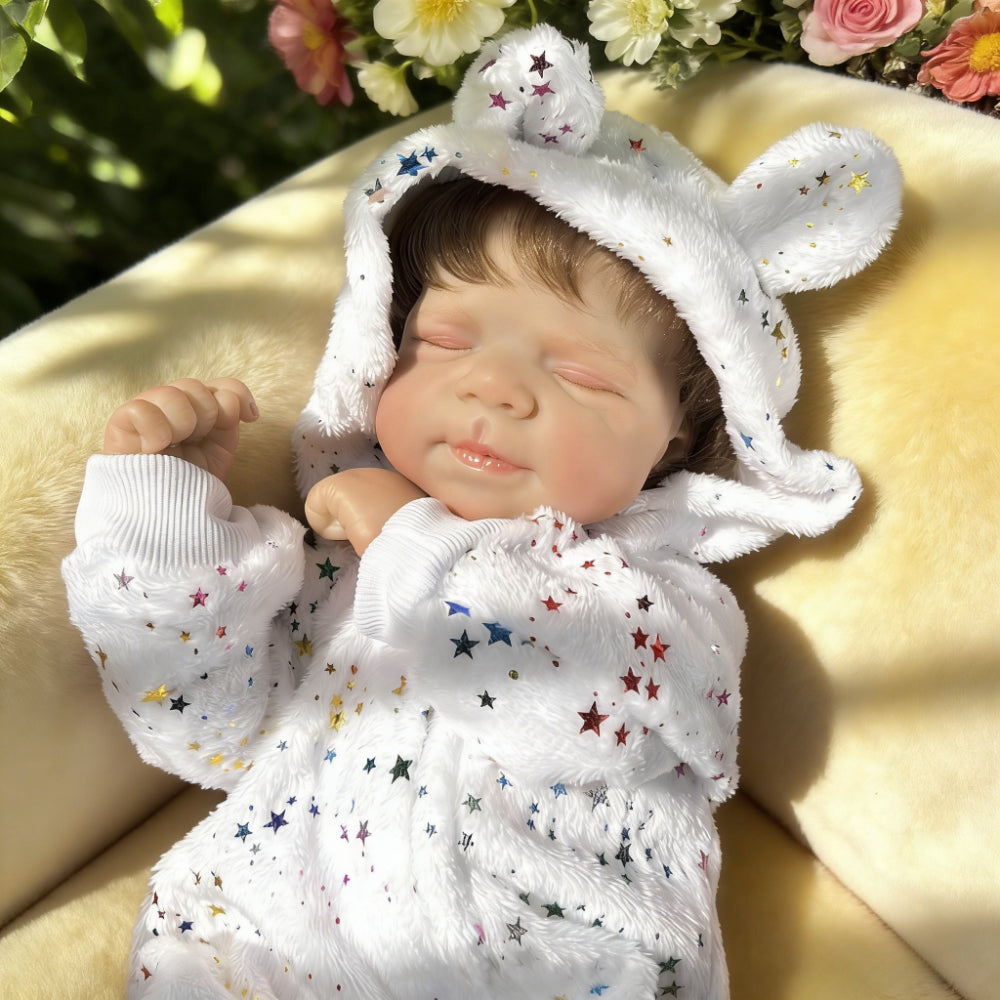 Pascale bambina reborn realistica con occhi chiusi alta 48 cm con tutina a stelle