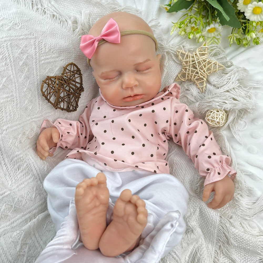 Bambina reborn Loulou addormentata in silicone estensibile alta 45 cm con vestitino a pois rosa