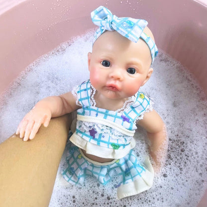 Neonata rinata in silicone da 30 cm con abito floreale blu