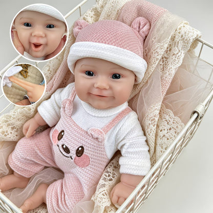 Bambola reborn Maddie Smile da 30 cm interamente in silicone vestita con un orsetto rosa