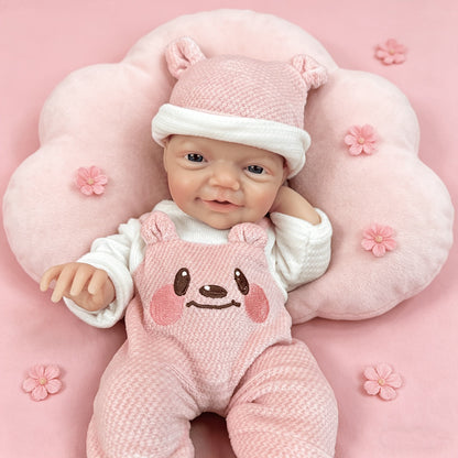 Bambina reborn Charlie alta 30 cm con sorriso realistico e occhi azzurri in silicone vestita con abiti da orsetto rosa