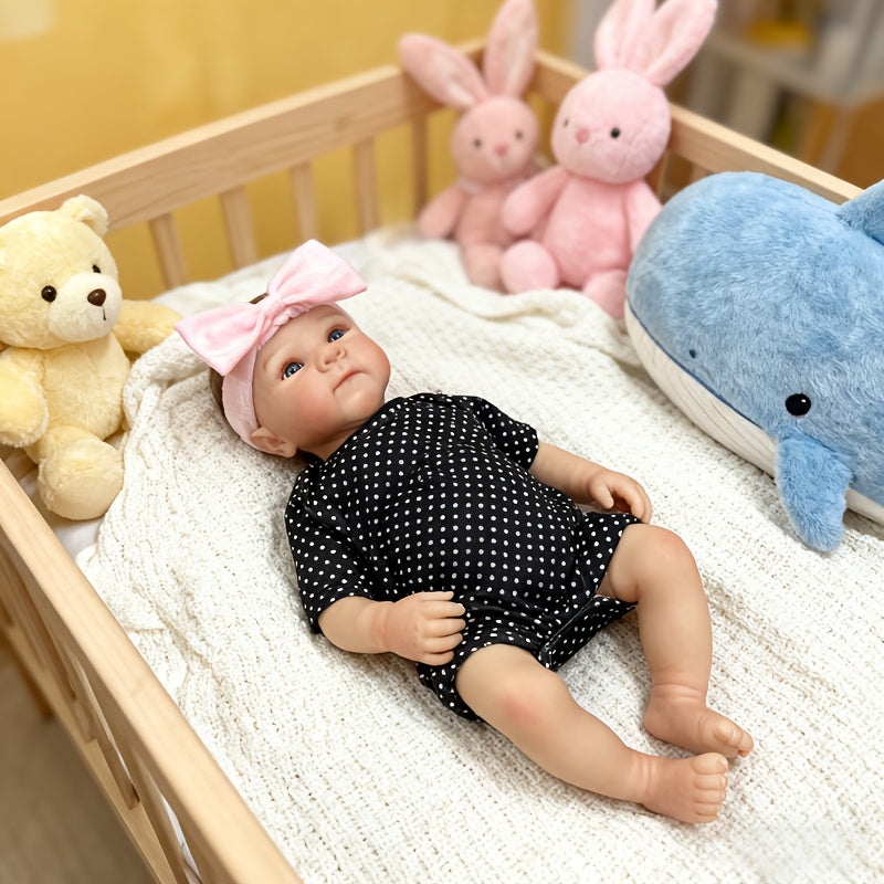 Bambina rinata Bettie con occhi aperti 48 cm in abiti a pois neri