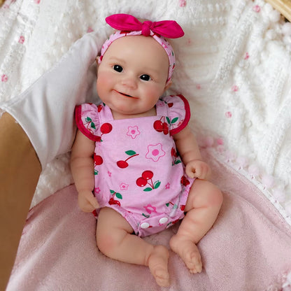 Bambola Reborn femmina Maddie Smile da 30 cm in silicone pieno con completino rosa a fantasia di ciliegie
