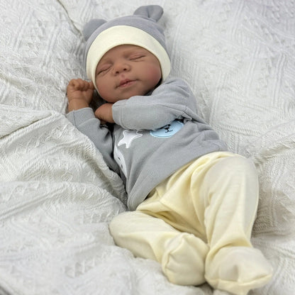 Bambola Reborn Pascale da 48 cm corpo morbido e realistico occhi chiusi pelle scura