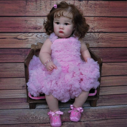 Bambola Reborn Charlotte da 60 cm con occhi aperti e capelli castani in abito rosa