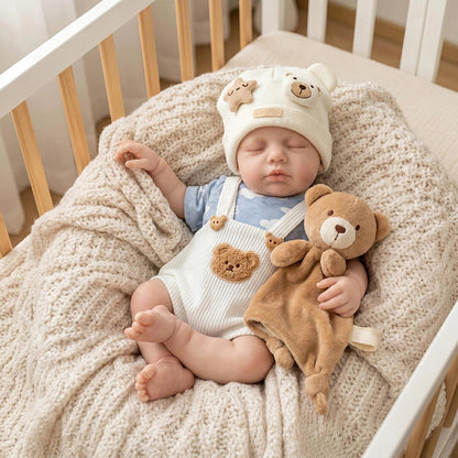 Bambola reborn Loulou da 30 cm interamente in silicone vestita con un orsetto