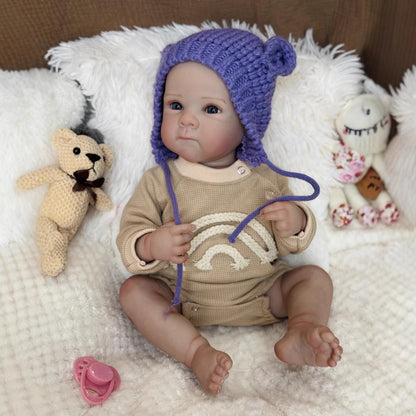 Bambina Reborn Kelly Occhi azzurri da 50 cm con cappello viola - Bettie