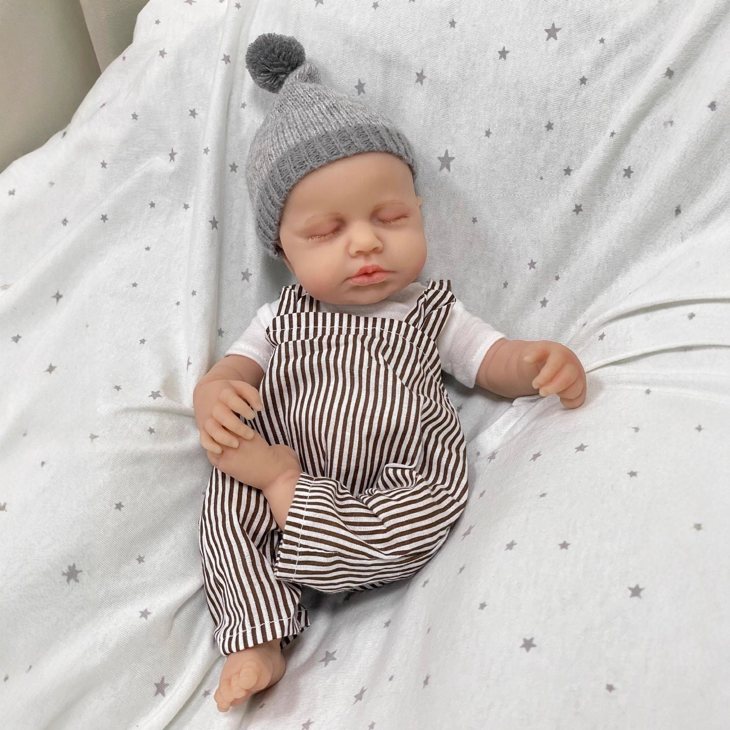 Bambola reborn Loulou addormentata in silicone realistico da 30 cm con vestiti a righe