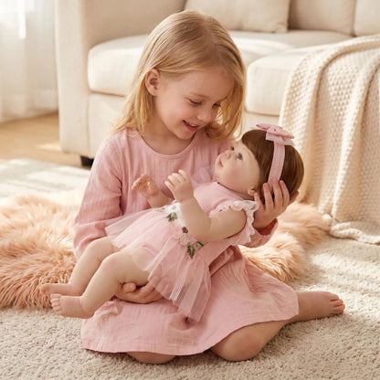Bambola reborn Abigail da 19 pollici con capelli corti e vestito rosa