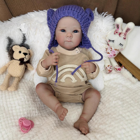 Bambina Reborn Kelly Occhi azzurri da 50 cm con cappello viola - Bettie