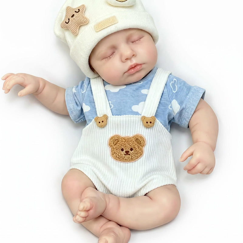 Bambola reborn Loulou da 30 cm interamente in silicone vestita con un orsetto