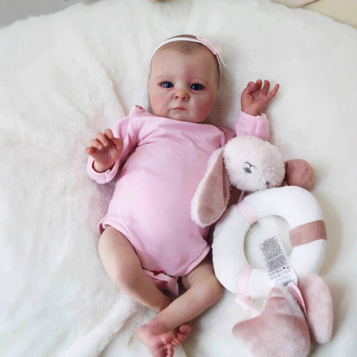Bambola reborn realistica da 40 cm con occhi aperti Tink in abiti rosa