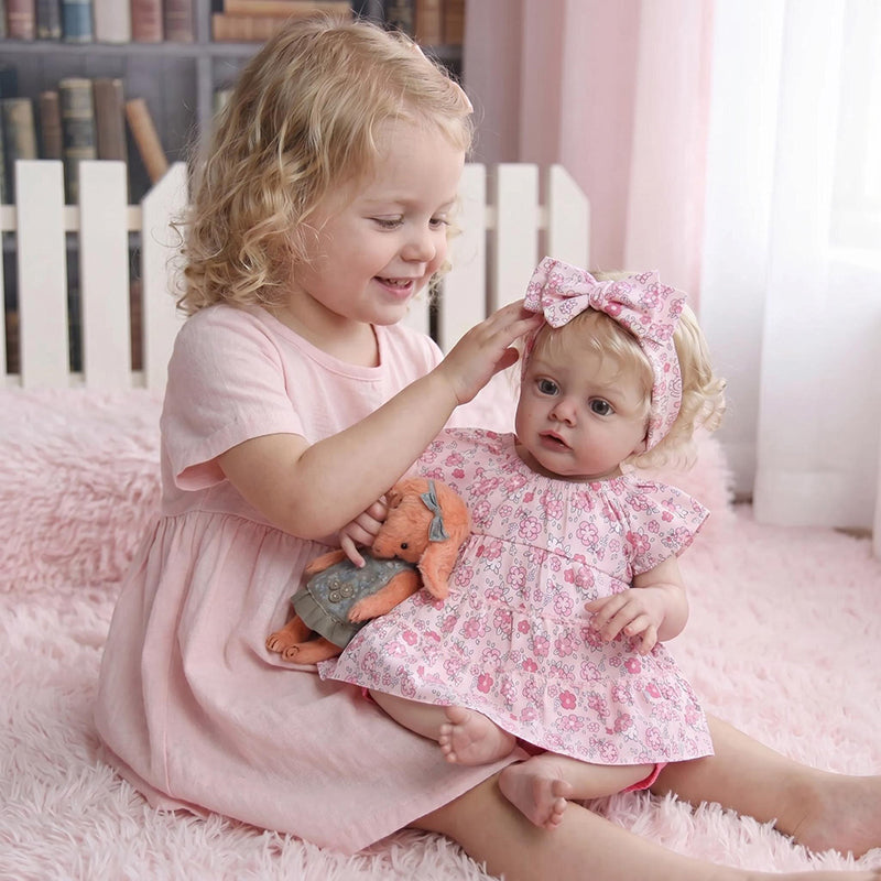 Bambola reborn Chloe da 19 pollici con capelli biondi e vestito floreale