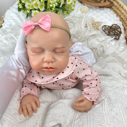 Bambina reborn Loulou addormentata in silicone estensibile alta 45 cm con vestitino a pois rosa