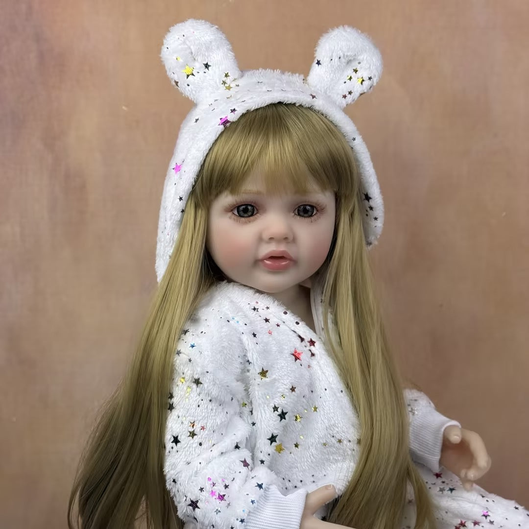 Bambina reborn Betty 55 cm occhi aperti lunghi capelli biondi con tutina a stelle