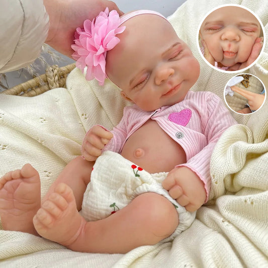 Bambola reborn Pascale in silicone alta 45 cm completamente estensibile addormentata con vestitino rosa