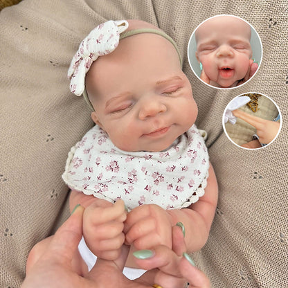 Bambola Reborn Pascale da 45 cm in silicone pieno flessibile dormiente con bavaglino a fiori