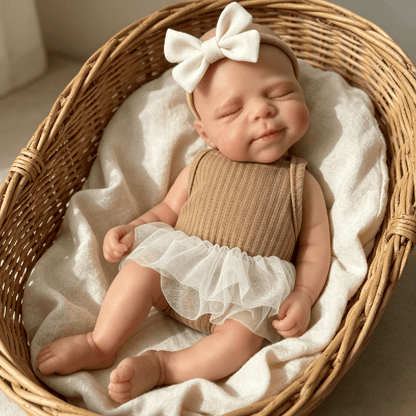 Bambola reborn in silicone Pascale da 30 cm addormentata con vestito marrone