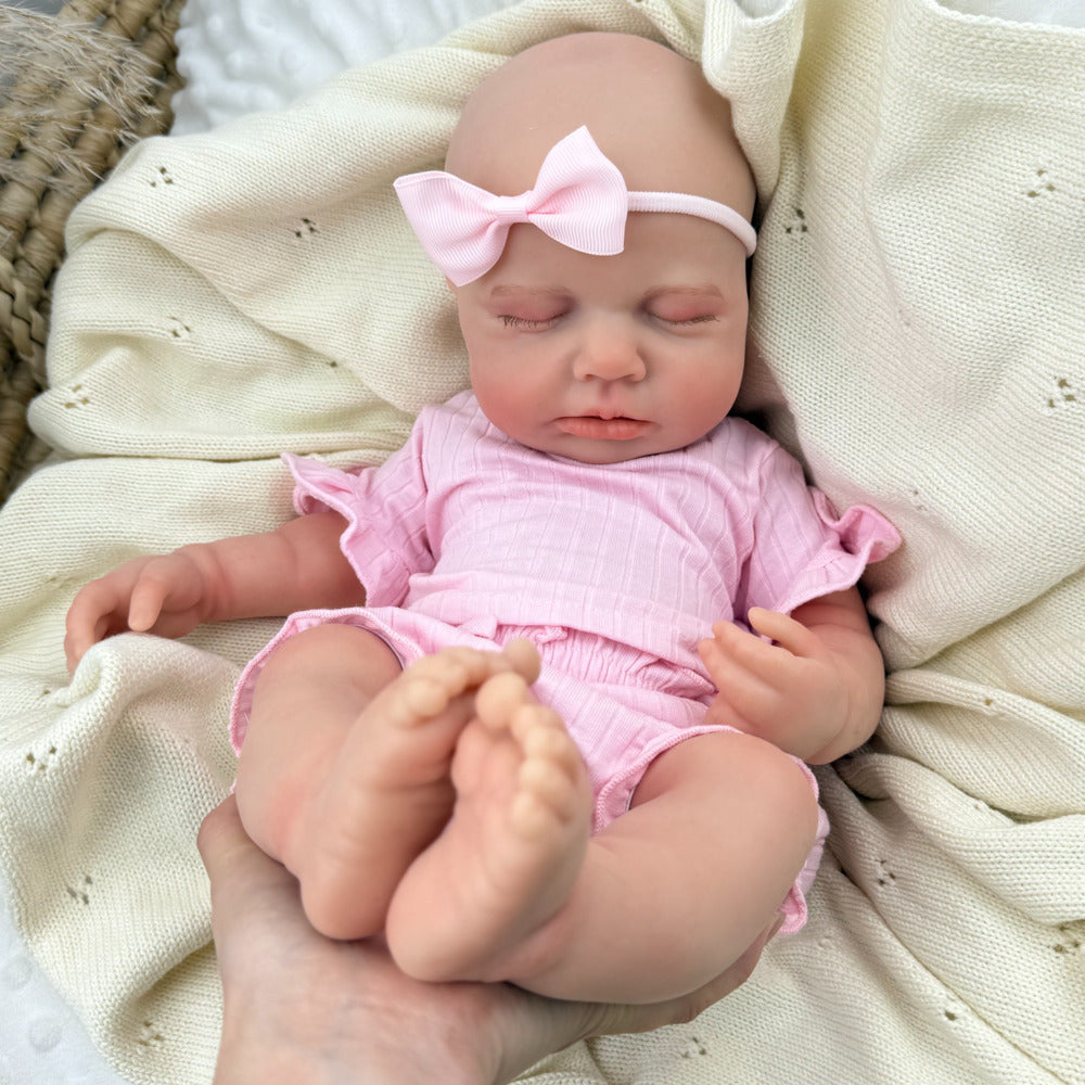 Bambina Reborn Loulou da 45 cm in silicone pieno ed elastico (occhi chiusi) con completino rosa