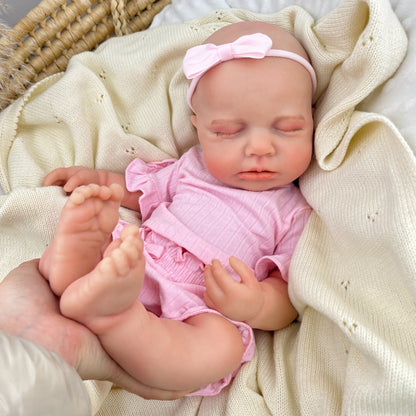 Bambina Reborn Loulou da 45 cm in silicone pieno ed elastico (occhi chiusi) con completino rosa