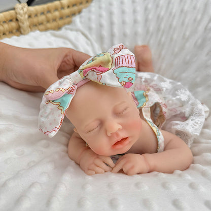 Bambola Reborn Loulou da 30 cm in silicone pieno occhi chiusi con vestitino in pizzo a fiori