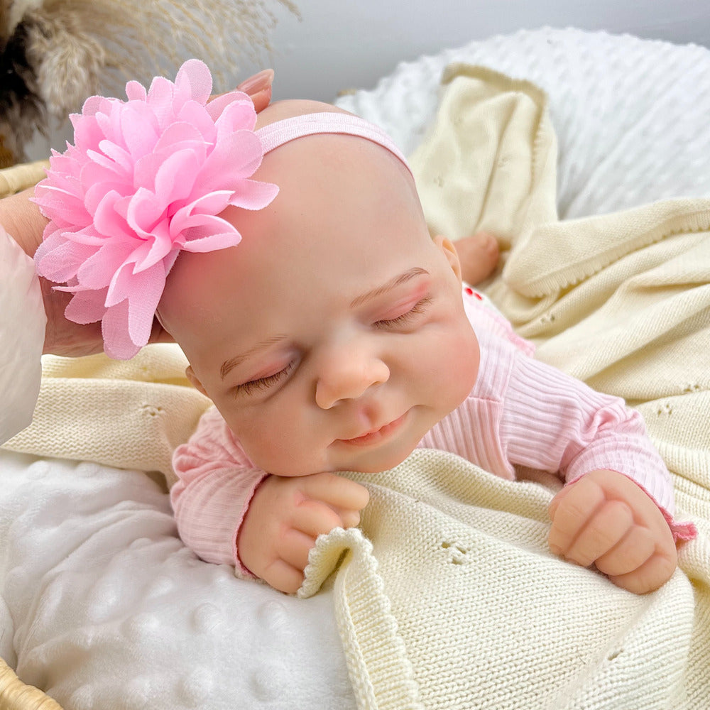 Bambola reborn Pascale in silicone alta 45 cm completamente estensibile addormentata con vestitino rosa