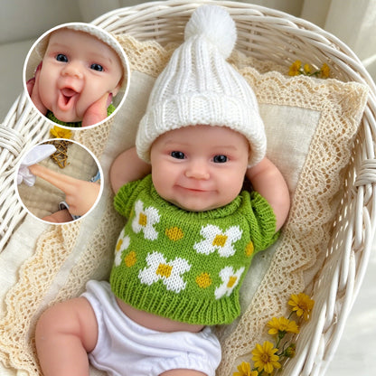 Bambola reborn Maddie Smile da 30 cm interamente in silicone con vestitino verde