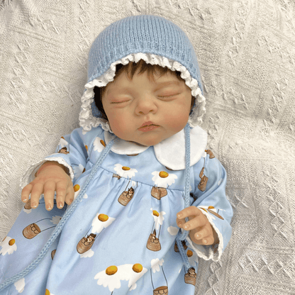 Bambola reborn Irys da 19 pollici con pittura 3D occhi chiusi e capelli corti vestita di blu