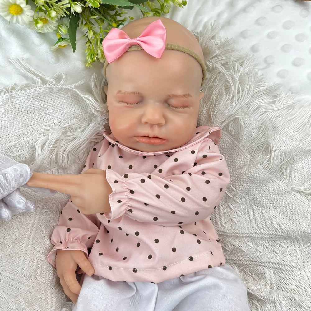 Bambina reborn Loulou addormentata in silicone estensibile alta 45 cm con vestitino a pois rosa