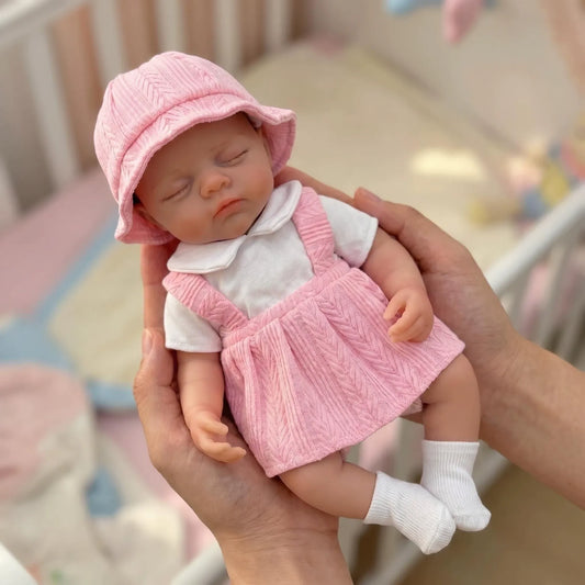 Bambola reborn Irys da 30cm interamente in silicone con vestito rosa