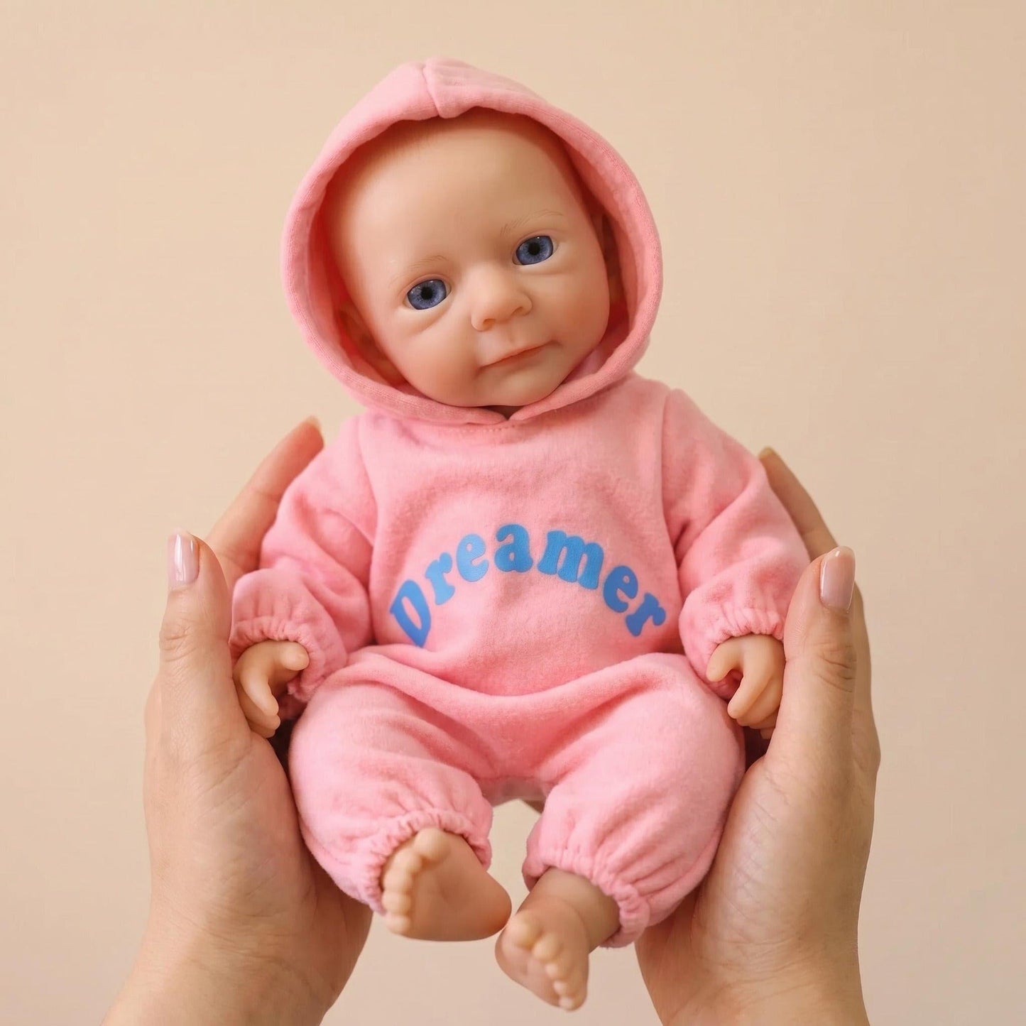 Bambina reborn Felicia da 30cm interamente in silicone con vestitino rosa