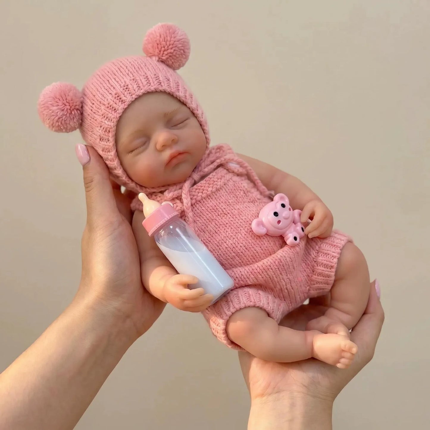 Bambola reborn Irys da 30cm interamente in silicone bambina con abiti rosa
