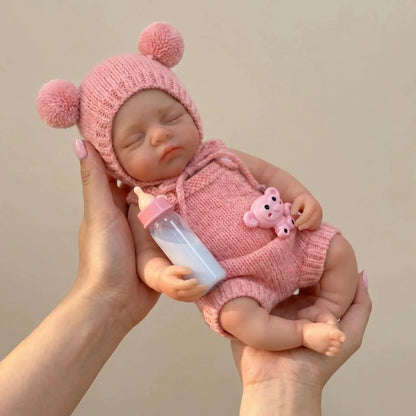 Bambola reborn Irys da 30cm interamente in silicone bambina con abiti rosa