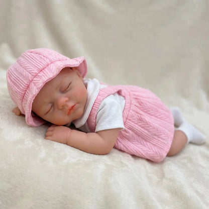 Bambola reborn Irys da 30cm interamente in silicone con vestito rosa